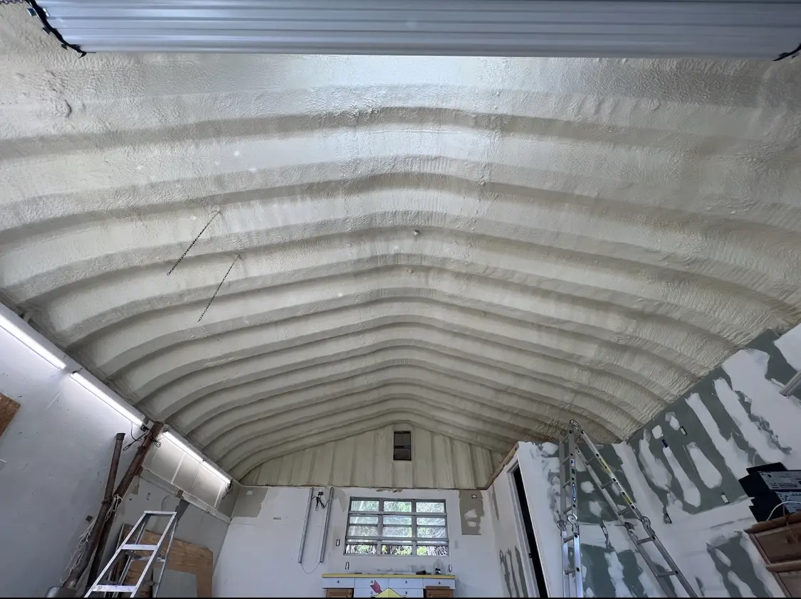 Spray polyurethane foam applied to the underside of a metal roof deck in DeFuniak Springs